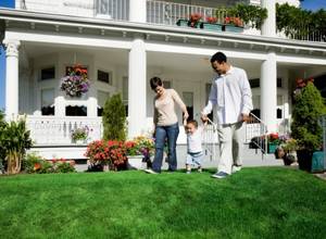 Family in front yard with artificial grass